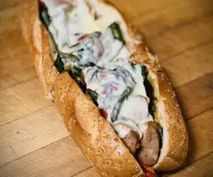 PORK KING SANDWICH (Sweet Sausage, Broccoli Rabe, Roasted Red Peppers & Mozzarella Cheese on a Seeded Grinder)
