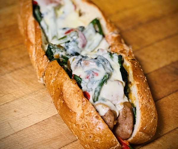 PORK KING SANDWICH (Sweet Sausage, Broccoli Rabe, Roasted Red Peppers & Mozzarella Cheese on a Seeded Grinder)