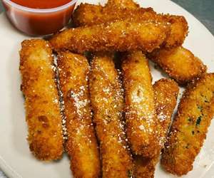 Homemade Fried Zucchini Sticks. Served with a side our own Tomato Sauce 