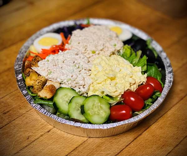 Three Scoop Salad (Garden Salad with one Scoop of our Homemade Chicken Salad, Egg Salad and Tuna Salad on top)